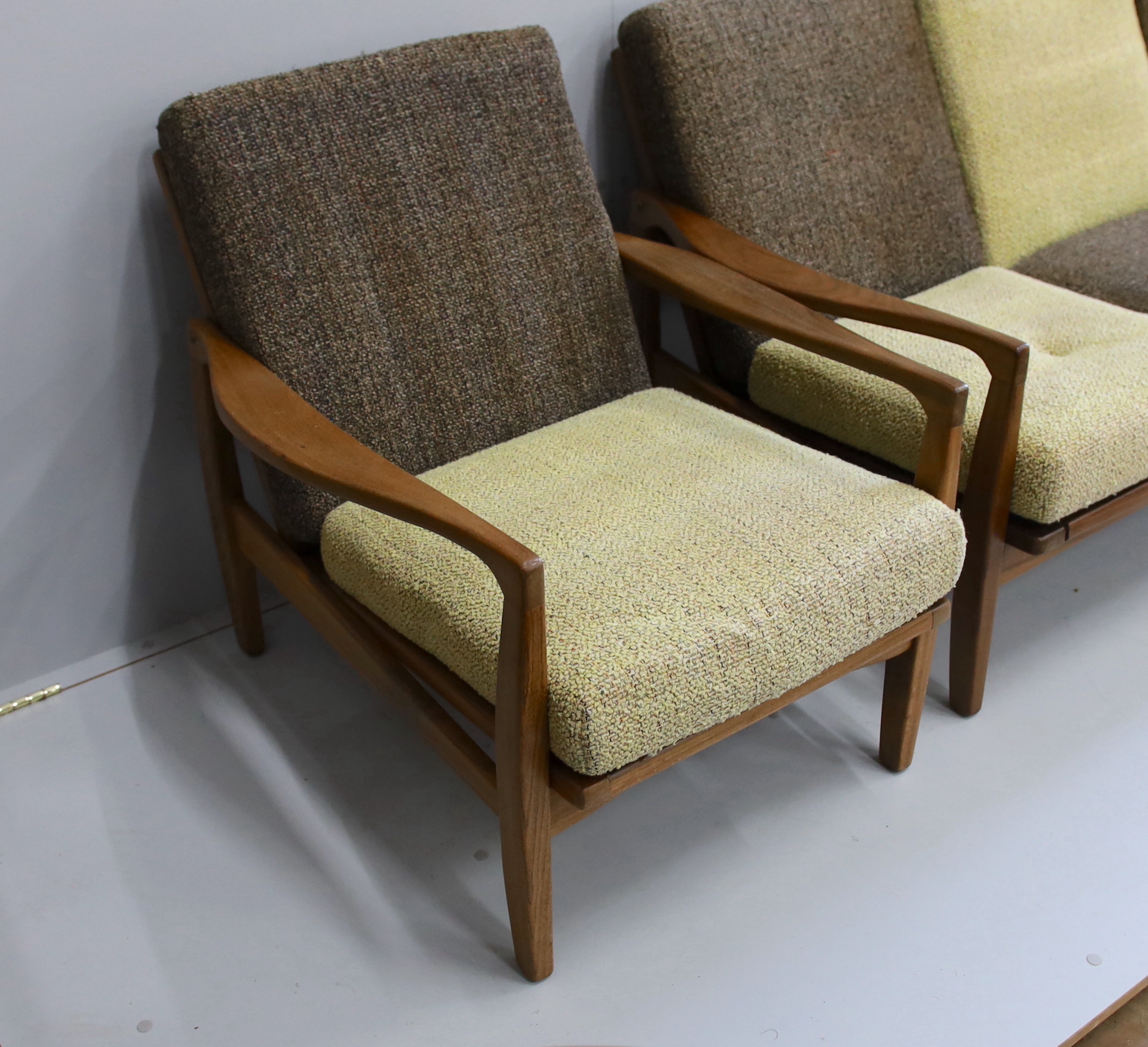 In the manner of Zenon Baczyk, a mid century teak three piece lounge suite, settee length 168cm, depth 88cm, height 68cm